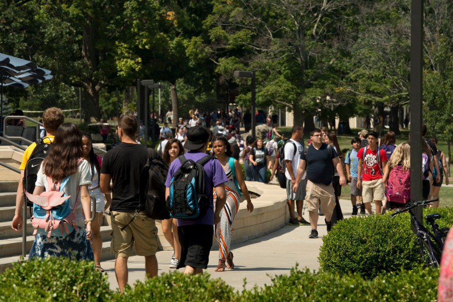 SIU students walking by Morris library between classes