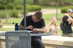 SIU student studying outside Morris Library